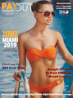 Cover of Payout Magazine 10.01 feauturing a babe in sunglasses and strapless orange bikini.